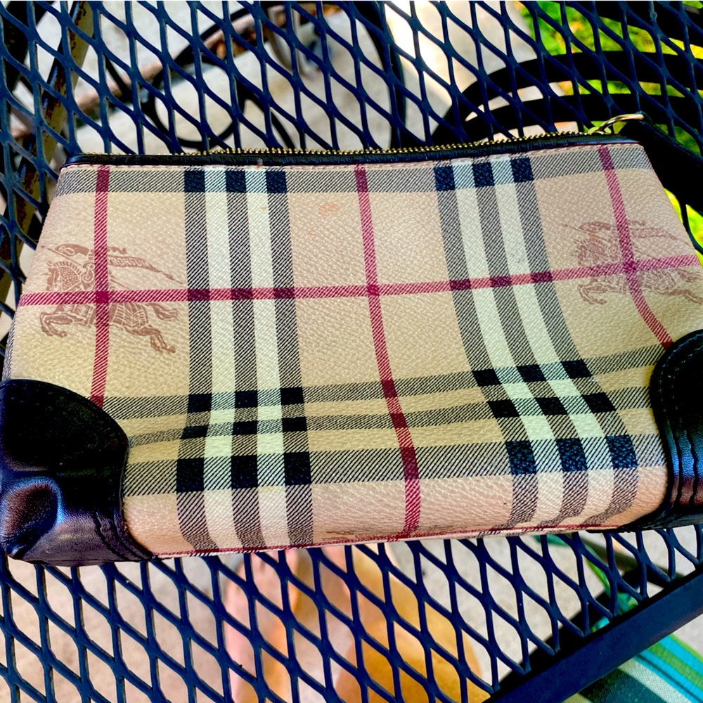 Authentic Burberry cosmetic bag.6 3/4 L x 4 1/2 H. Zip top. Very Good used cond.